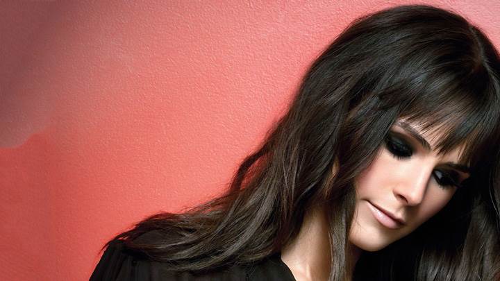 Jordana Brewster Looking Down N Pink Background